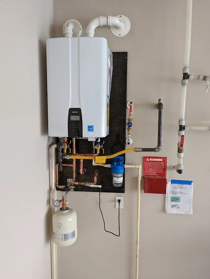 Professional plumber installing copper piping in a Lake home